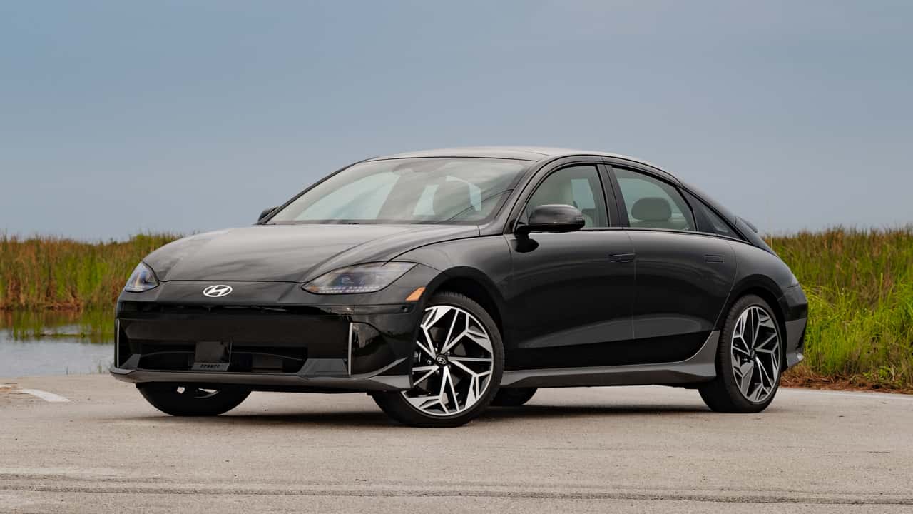 A black 2023 Hyundai Ioniq 6 electric sedan in a parking lot. 